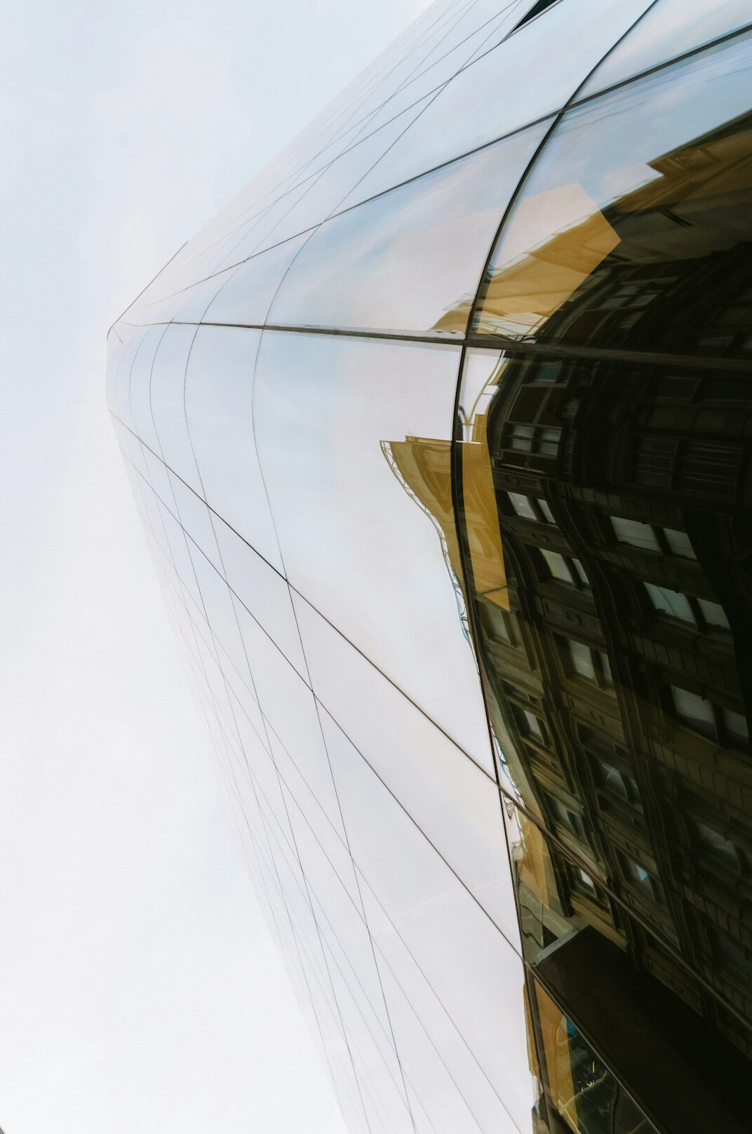 Modern glass office building seen from below